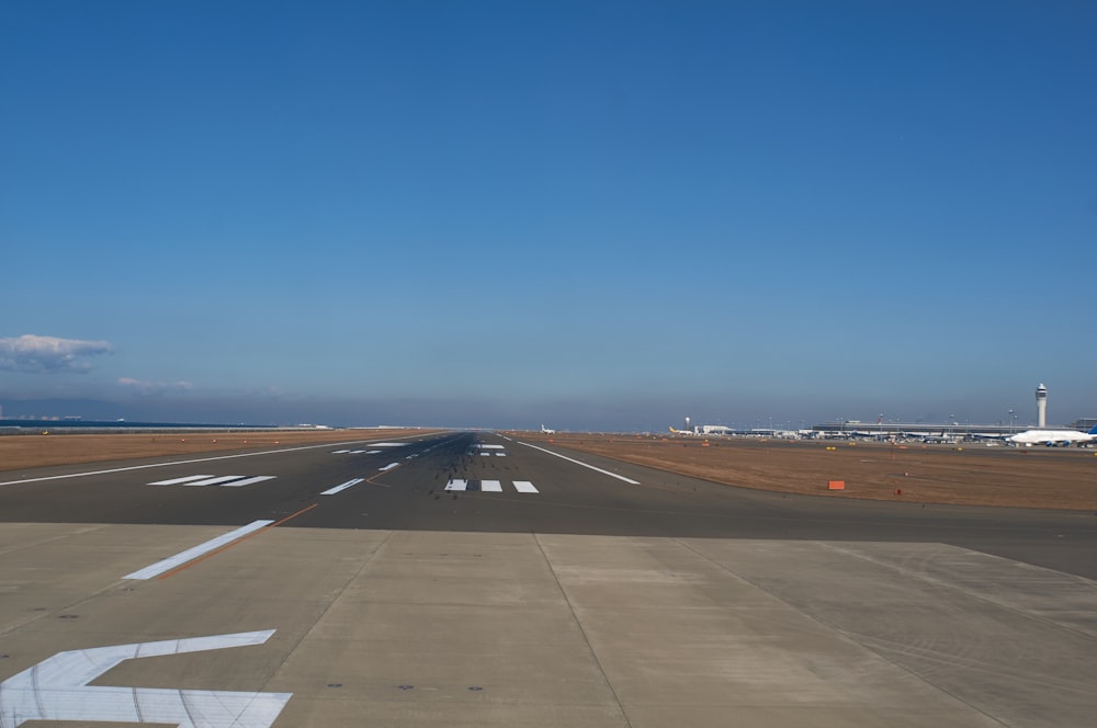 black asphalt road under blue sky during daytime