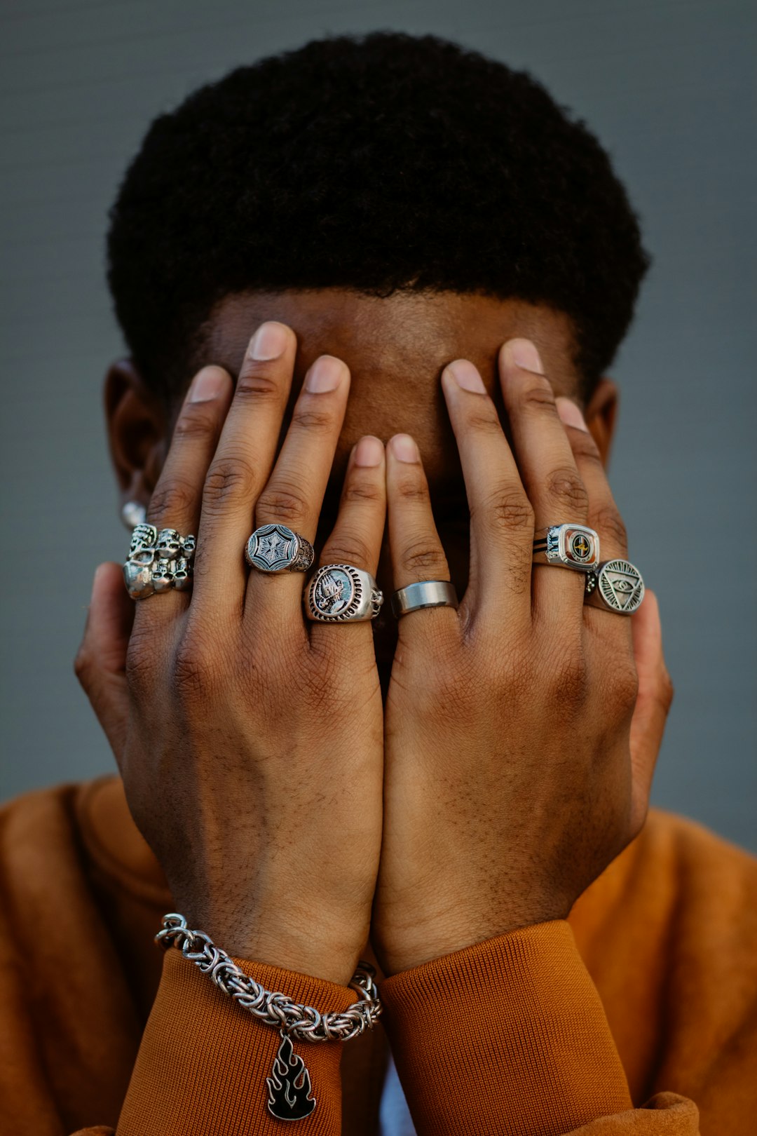 man wearing silver and diamond ring