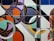 an abstract painting of circles and lines on a wall