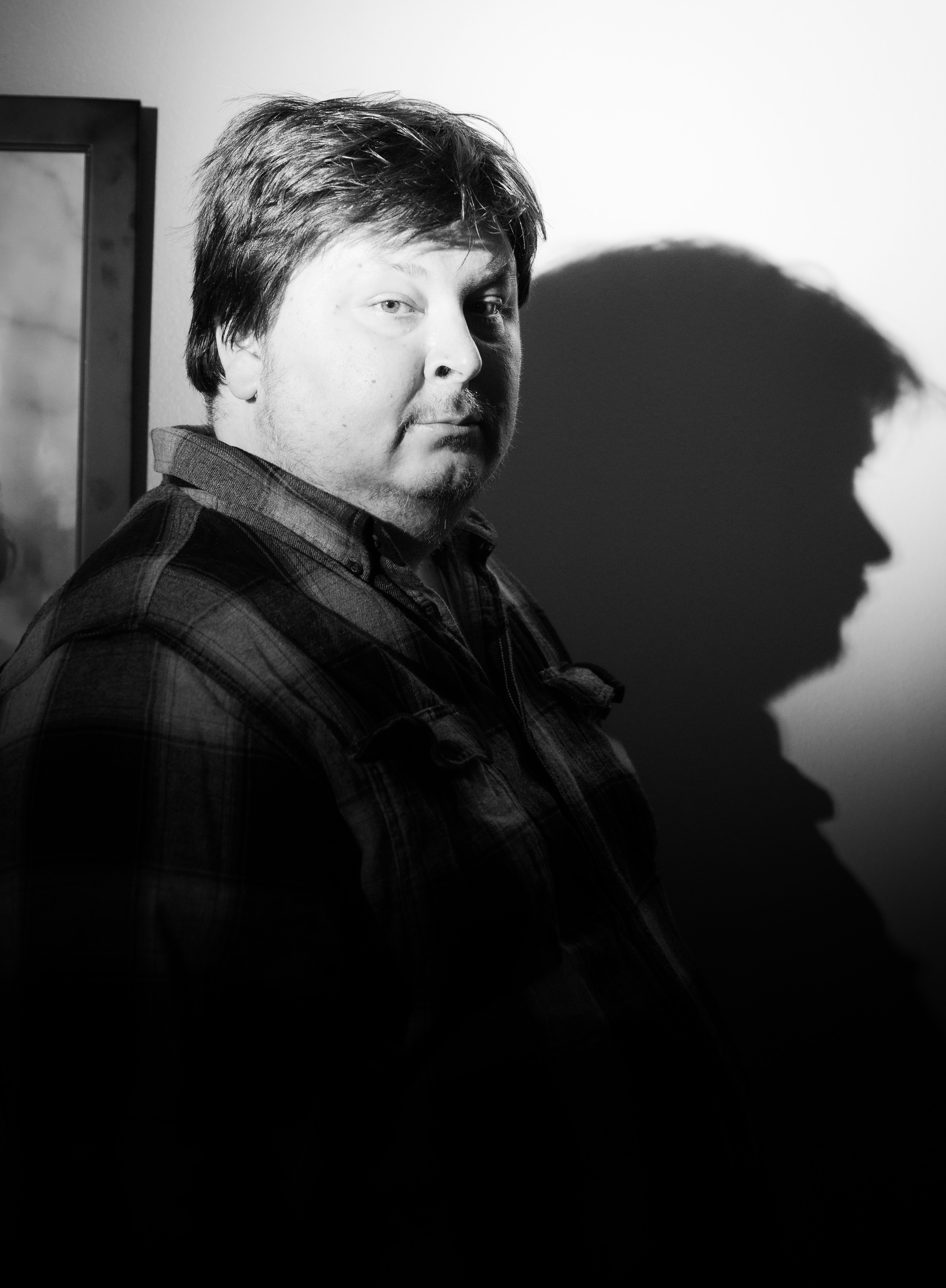 grayscale photo of man in black jacket