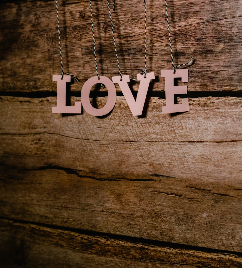 white and black love print on wooden surface