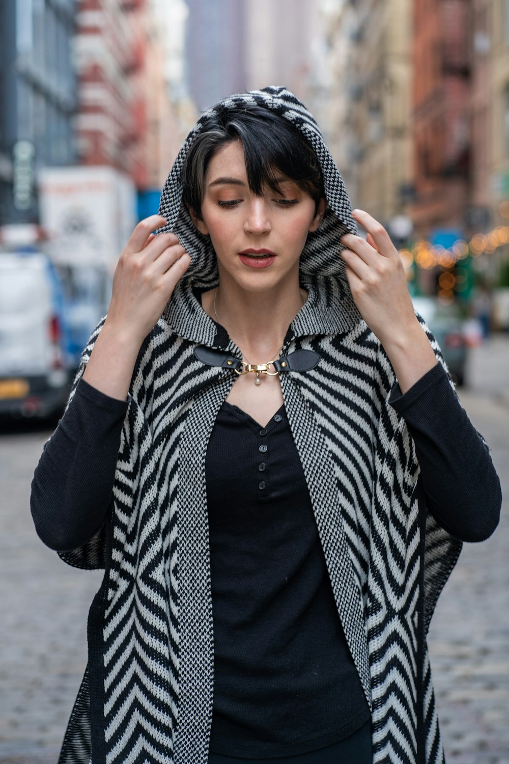 woman in black and white striped long sleeve shirt