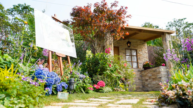 A serene British cottage garden filled with colorful flowers and greenery.