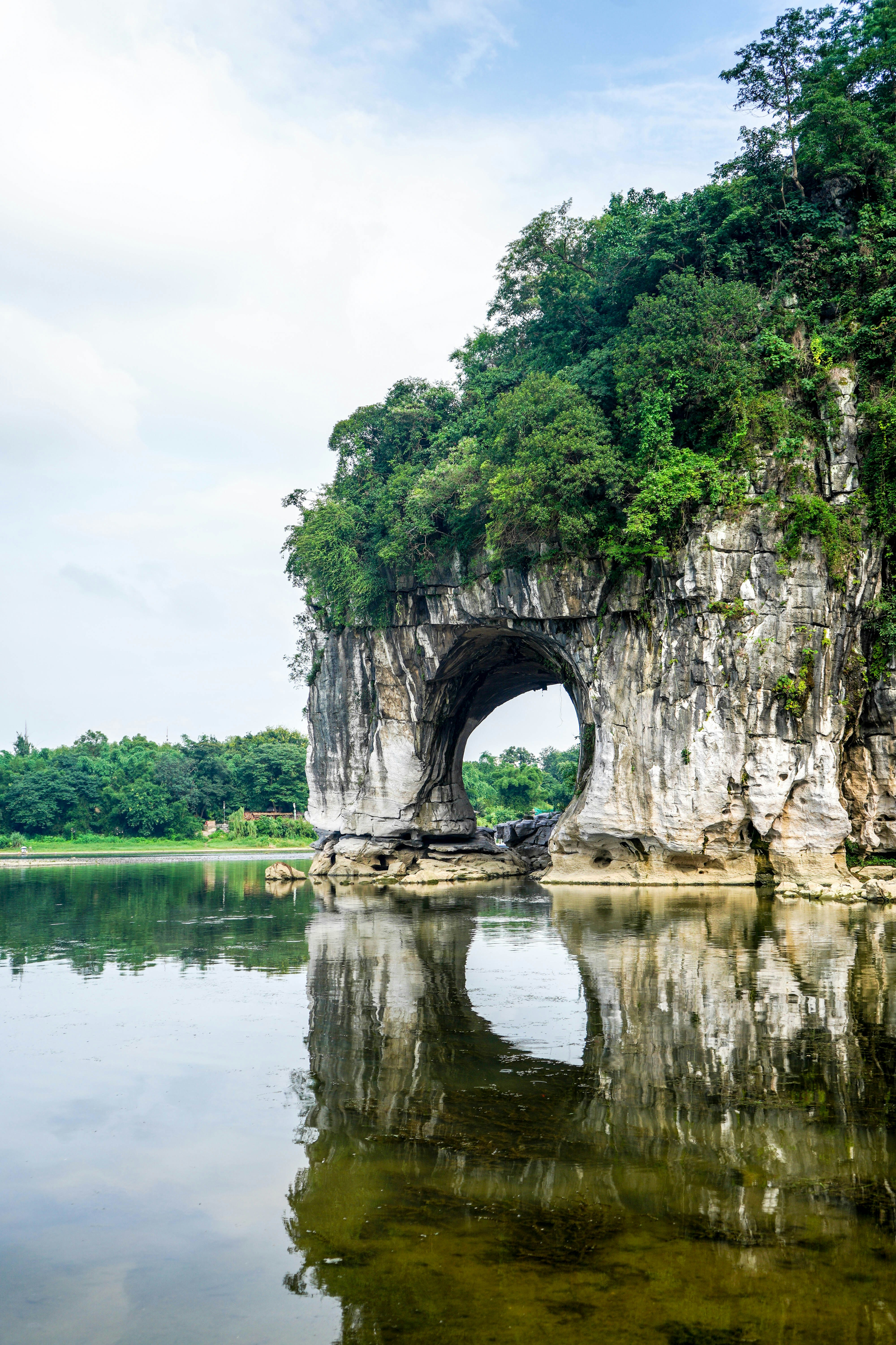 Gray concrete arch on lake during daytime photo – Free Grey Image on ...