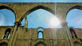 Historic St Paul Church ruins in Macau bathed in warm sunlight.