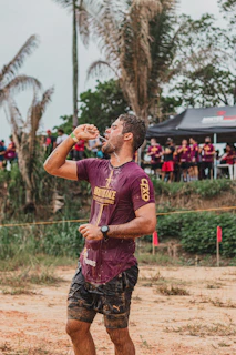 Iron Hearts volunteers handing out water bottles and smiles at a local triathlon event.