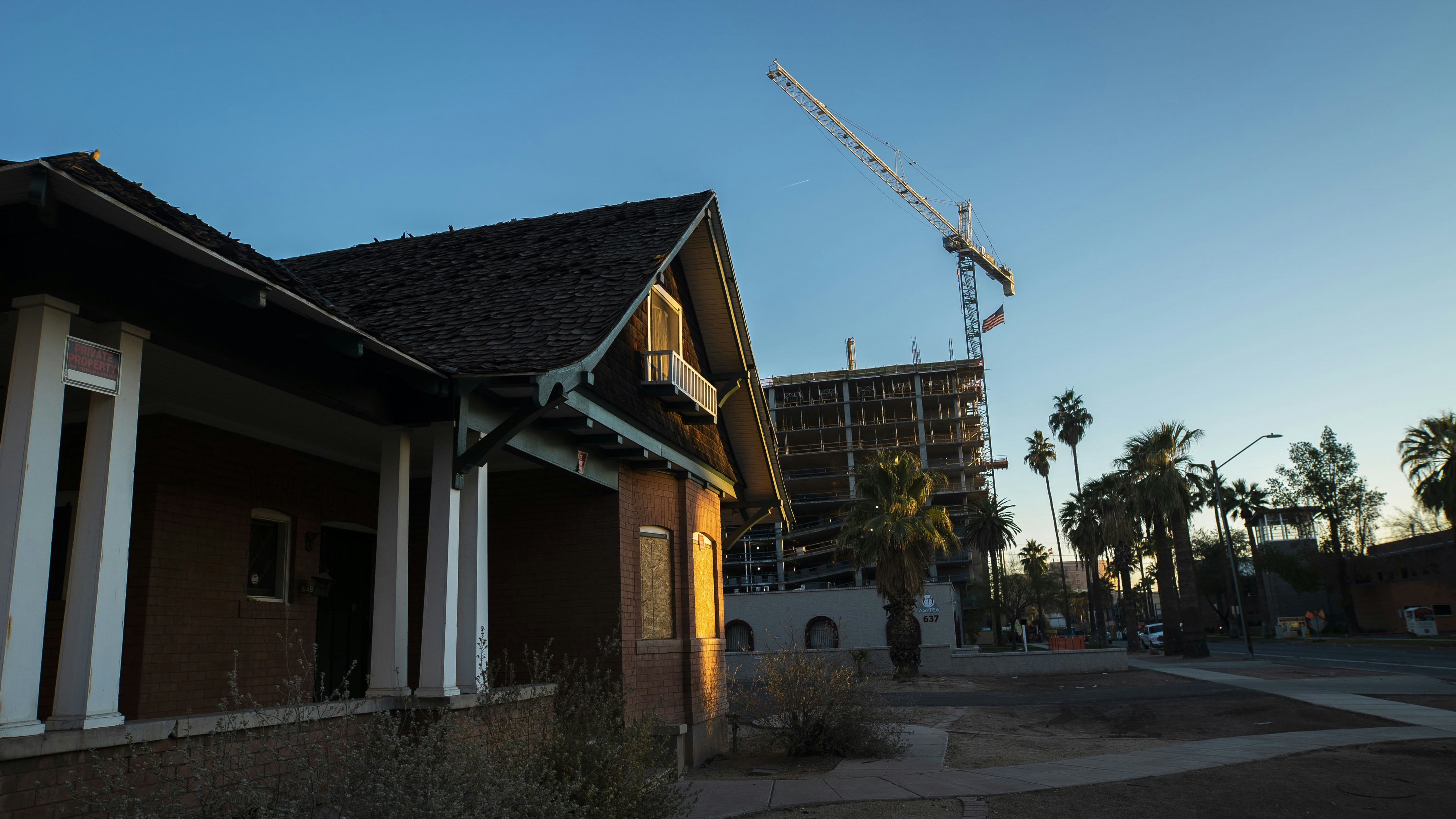 yellow and brown concrete house near green palm trees during daytime