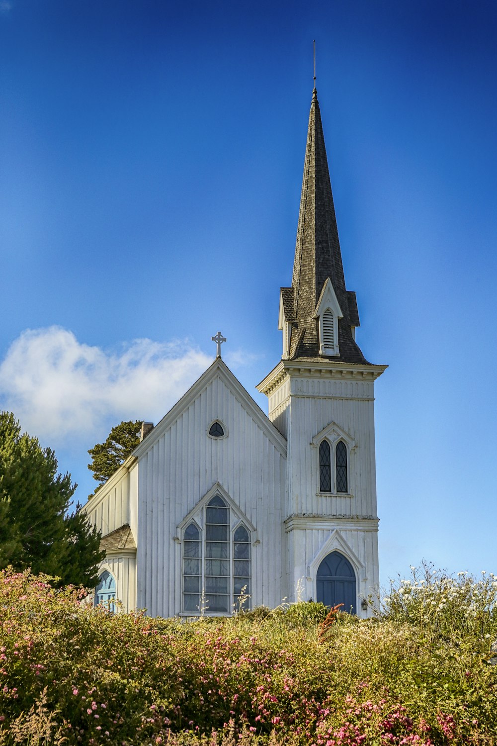 white and brown church under blue sky during daytime