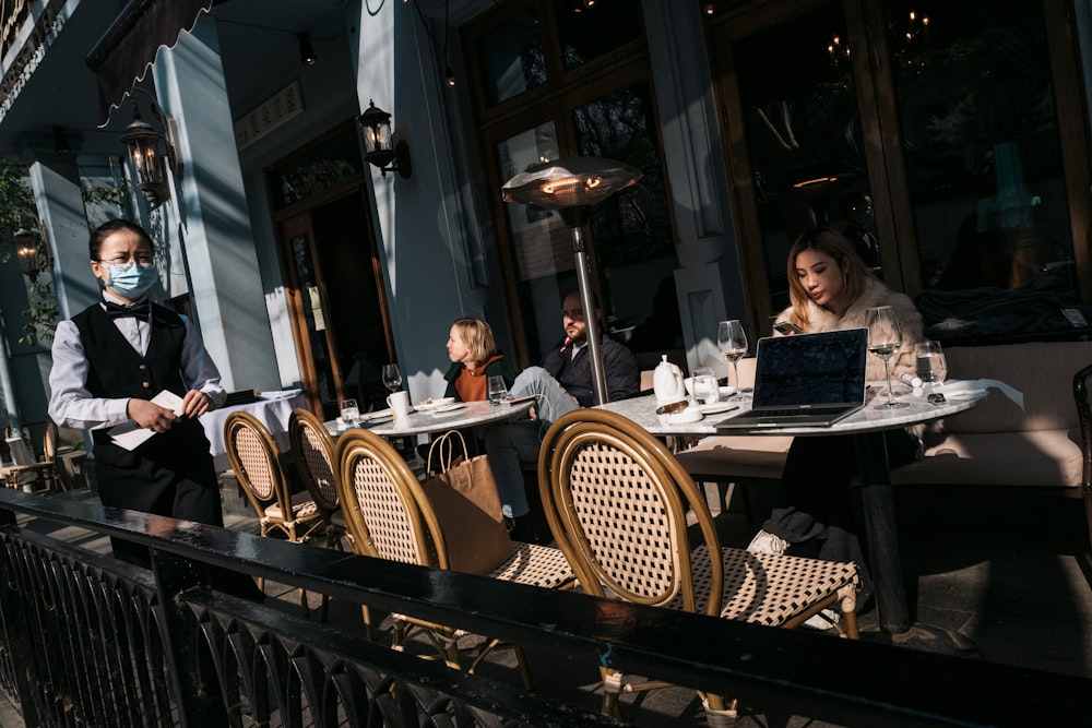 man and woman sitting on chair in restaurant