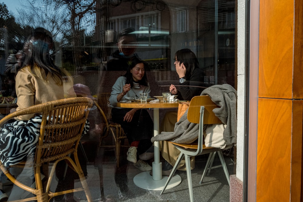 man and woman sitting on chair