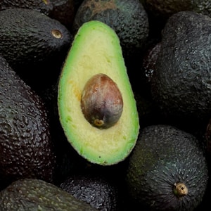 green and brown fruit on black and brown fruits