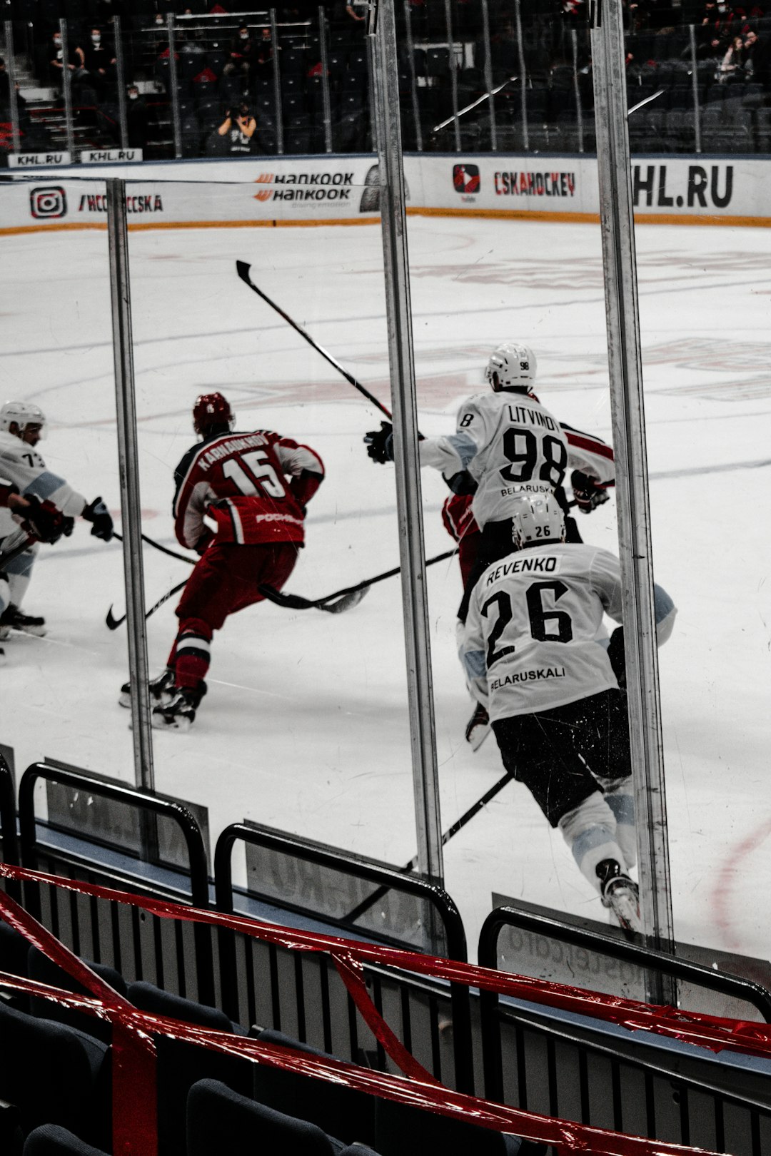 2 men in ice hockey jersey playing ice hockey