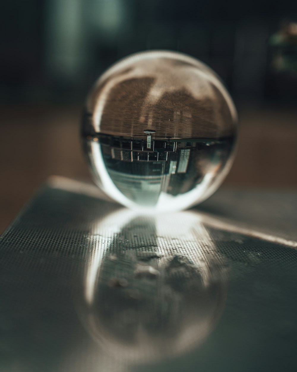 clear glass ball on black table