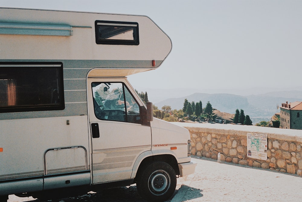 white and brown van on gray concrete road during daytime