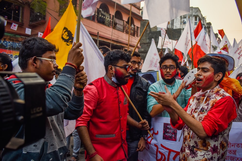 people holding flags during daytime