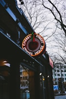Cherry-Grovestreet LLC’s signage displayed outside a charming brick building on a sunny day.