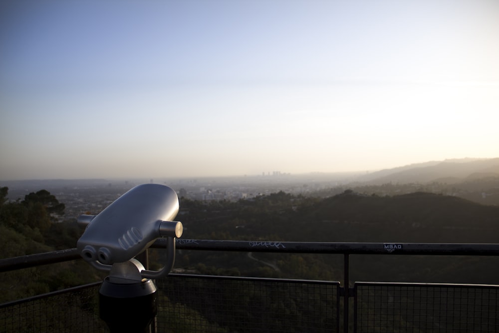 black and white telescope on top of the mountain