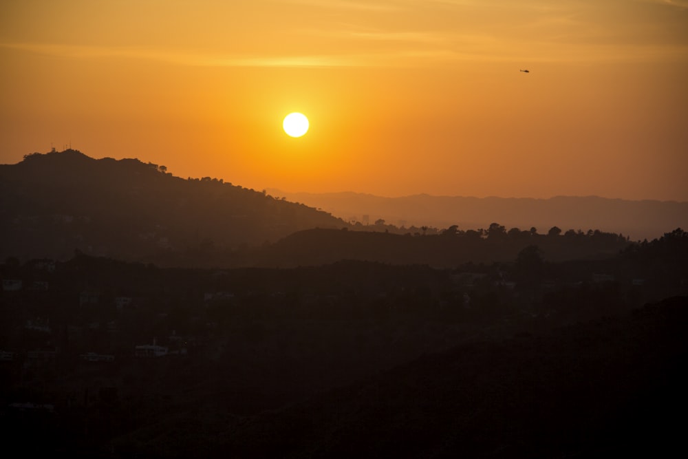 silhouette of mountains during sunset