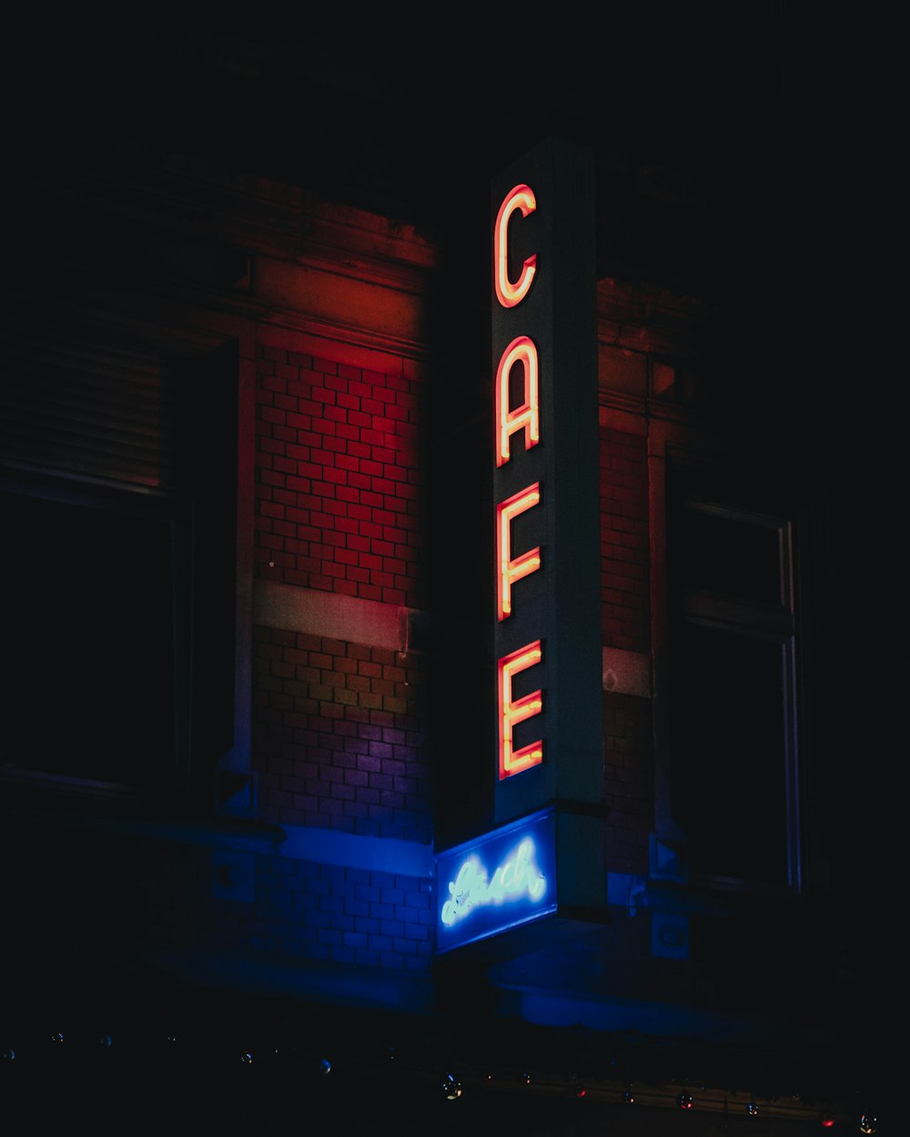 a building with a neon sign that reads castle