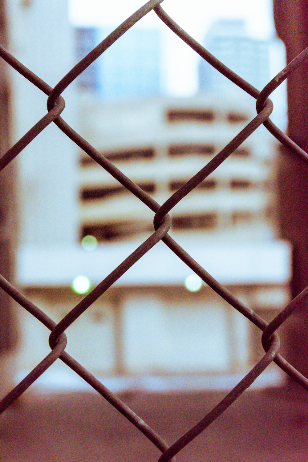 white and brown metal fence