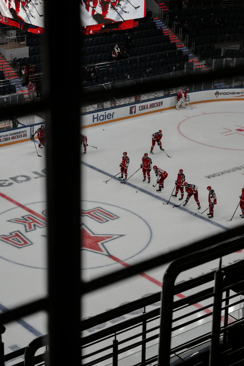 people playing ice hockey inside stadium