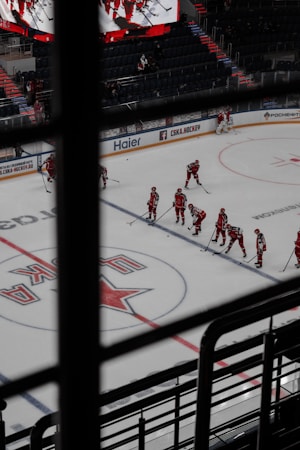 Players on the ice inside a hockey stadium during a regular season game, similar to a Silver Knights home night in Henderson