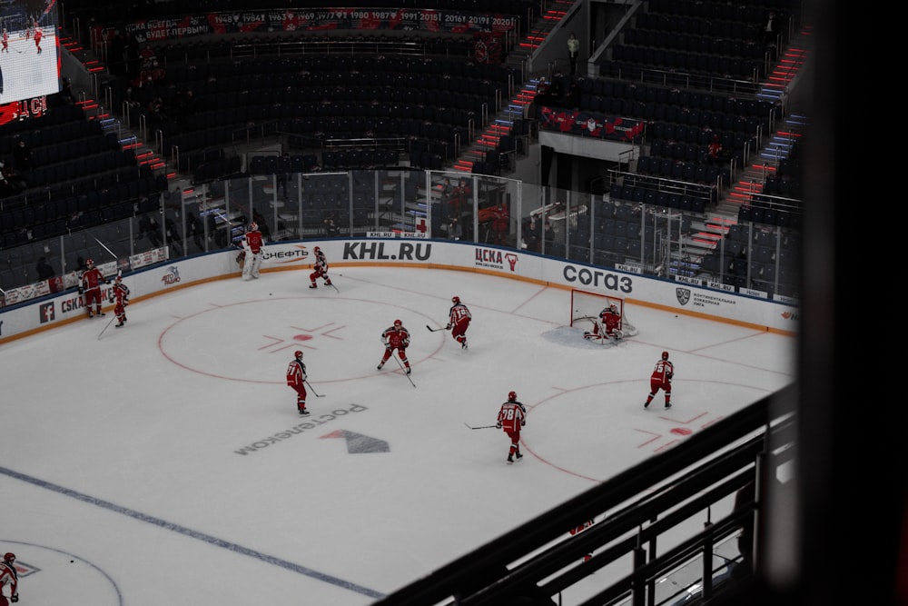 people playing ice hockey on stadium