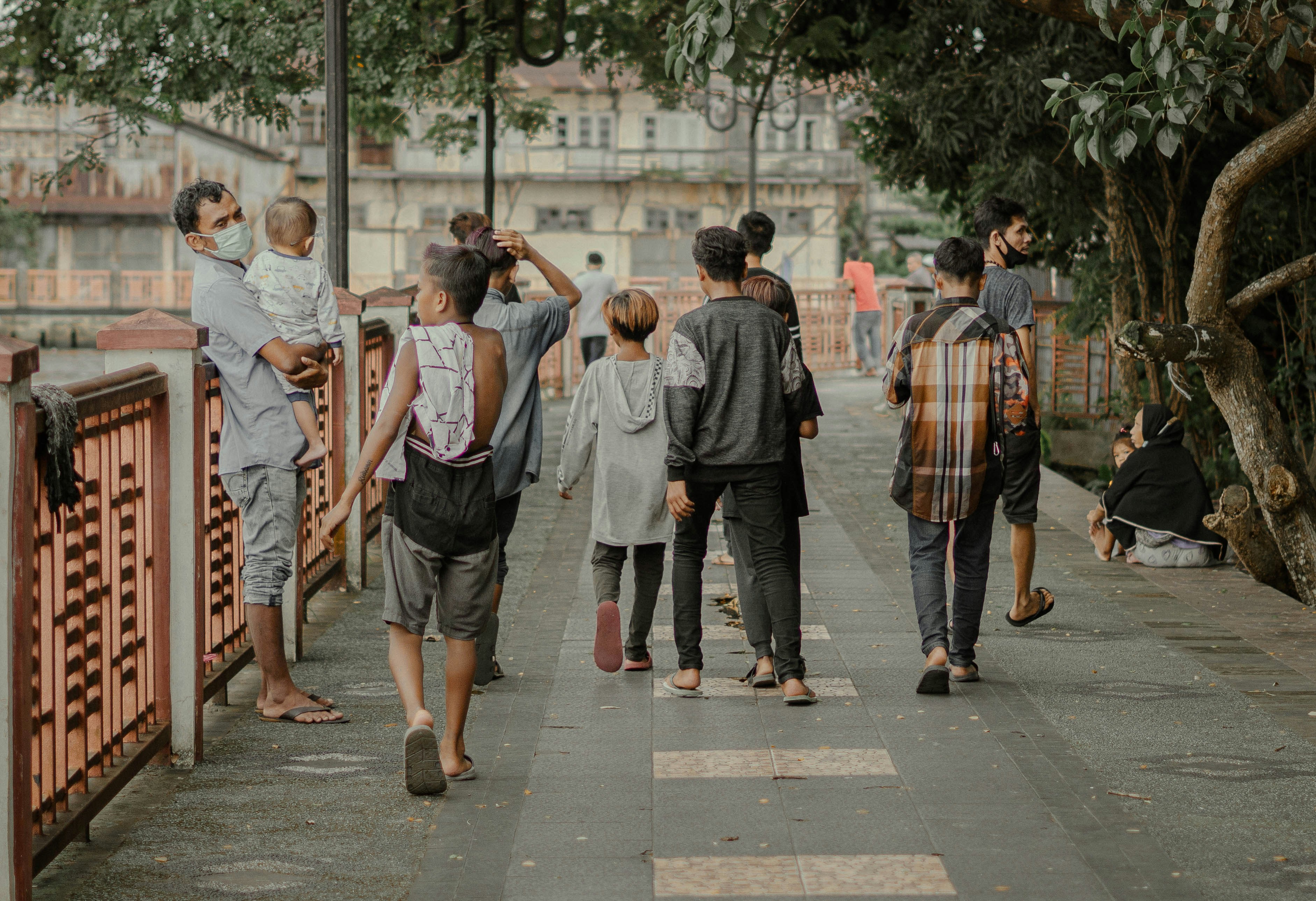 people walking on sidewalk during daytime