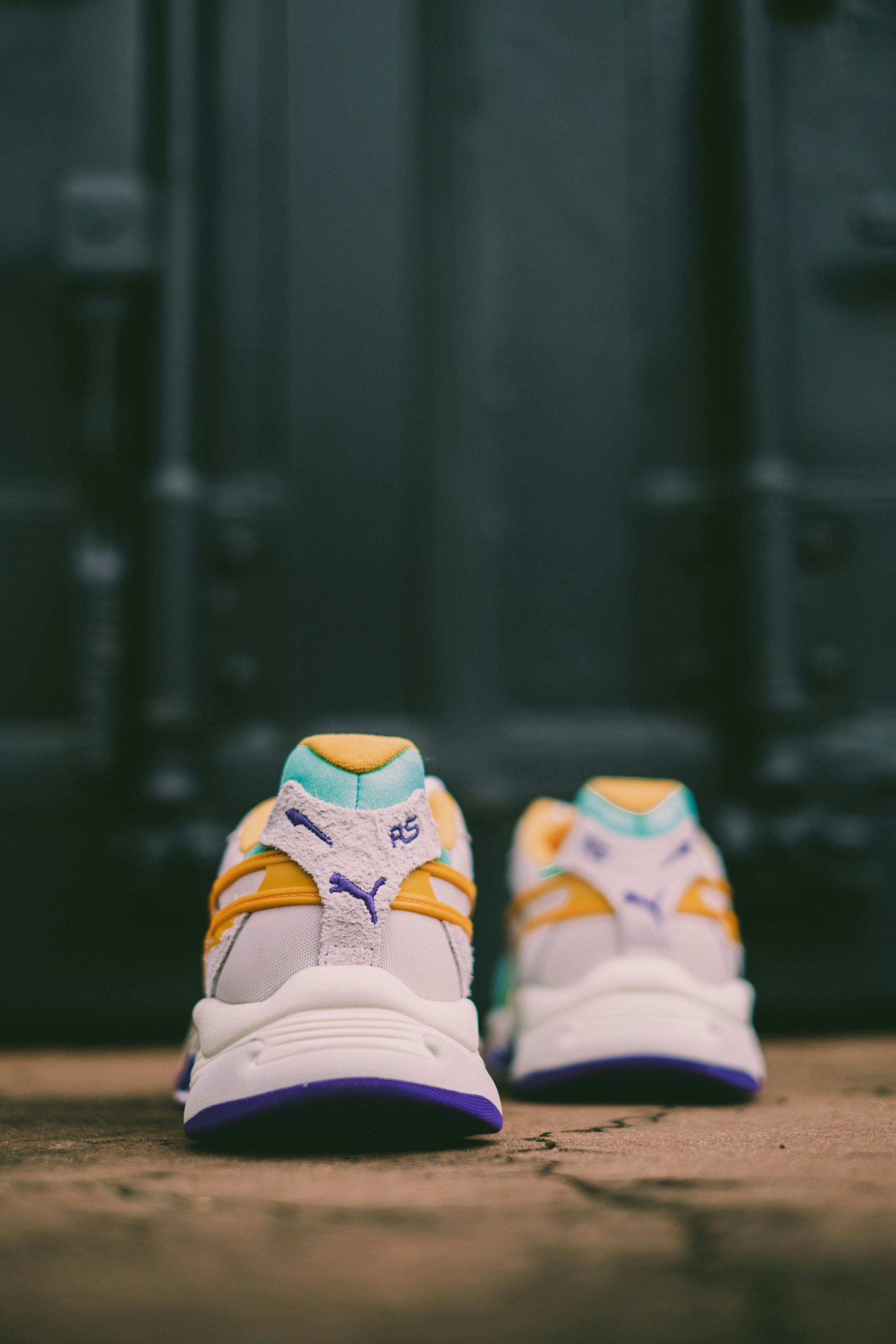 white and yellow adidas athletic shoes
