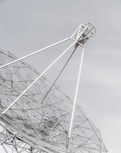 white and black satellite dish under blue sky during daytime