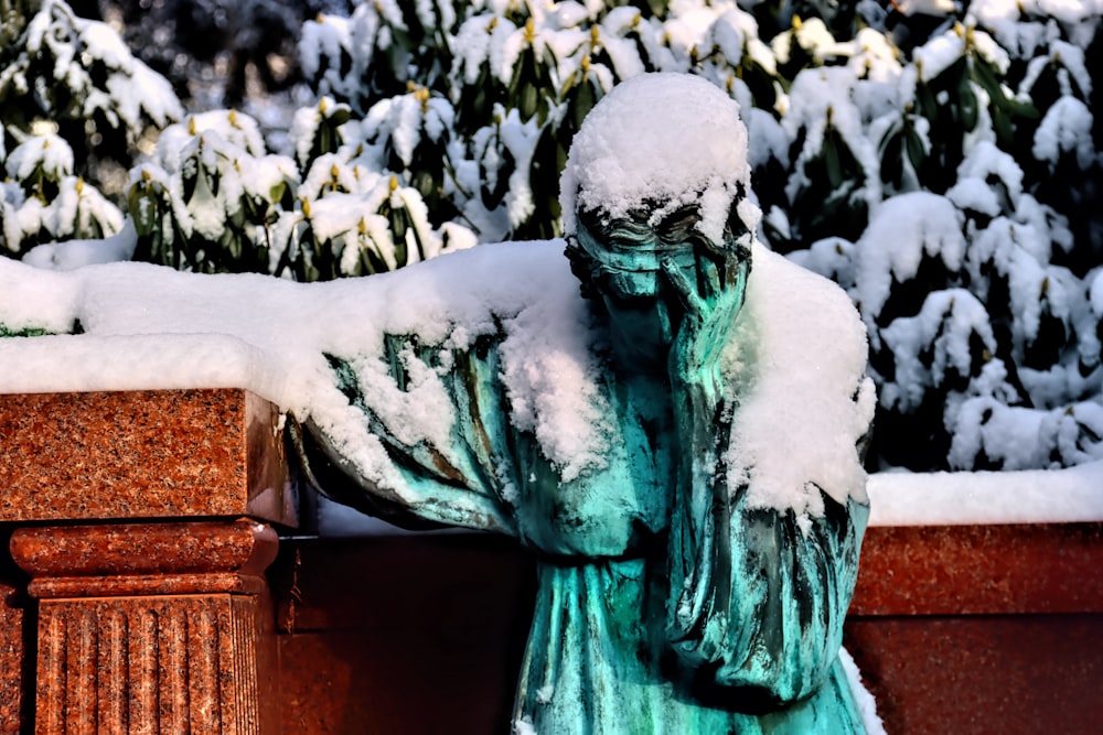 green statue of a man