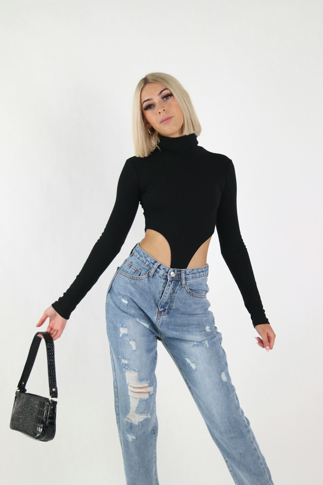 woman in black long sleeve shirt and blue denim jeans