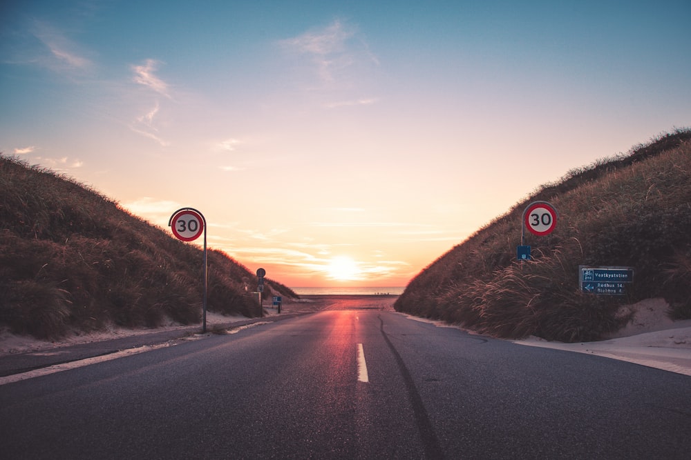 gray asphalt road during sunset