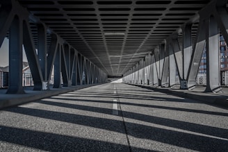 a long bridge with lots of metal beams