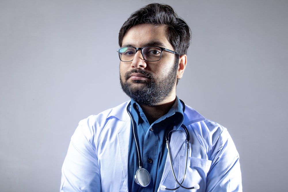 man in white dress shirt wearing blue lanyard