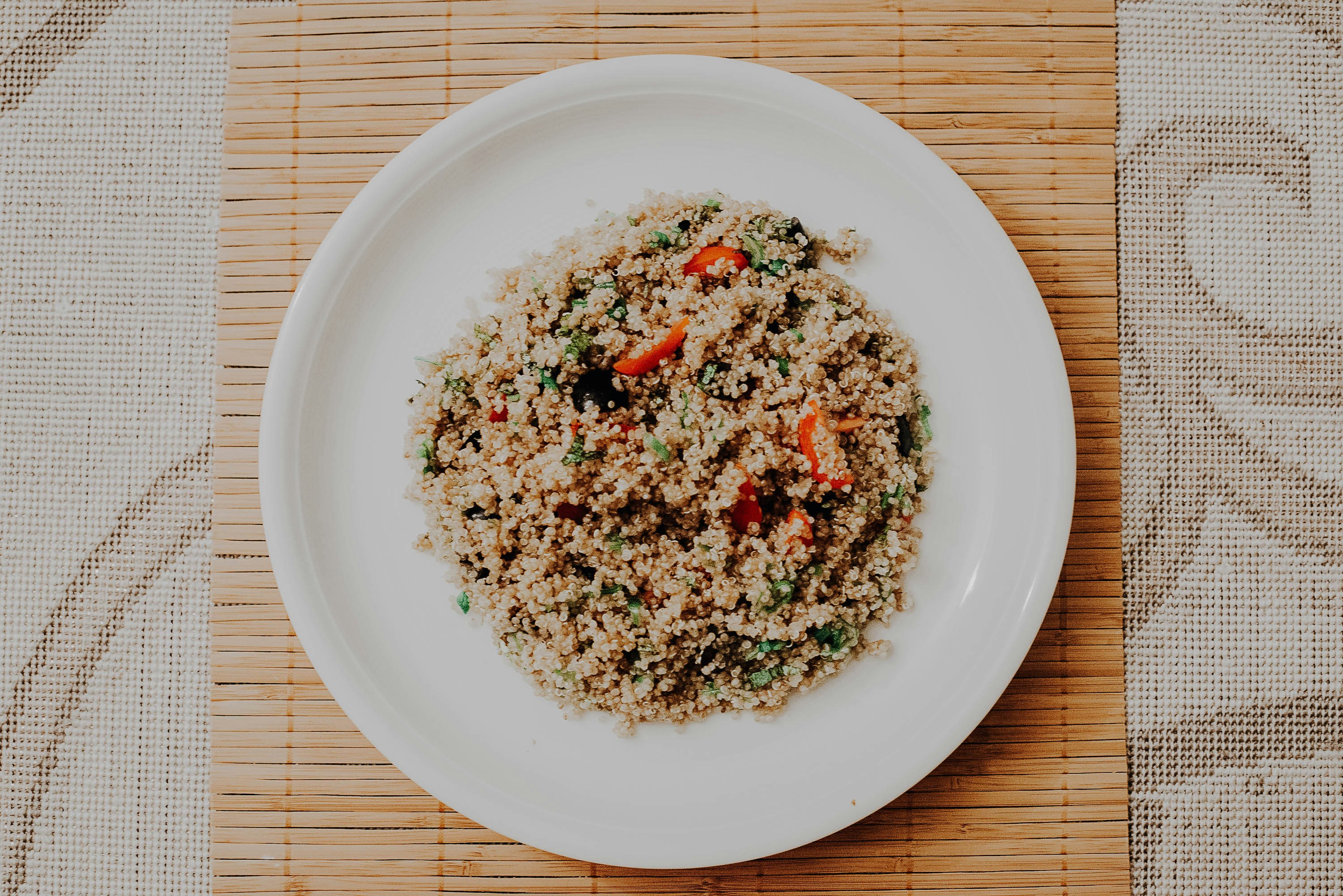green and red vegetable on white ceramic plate