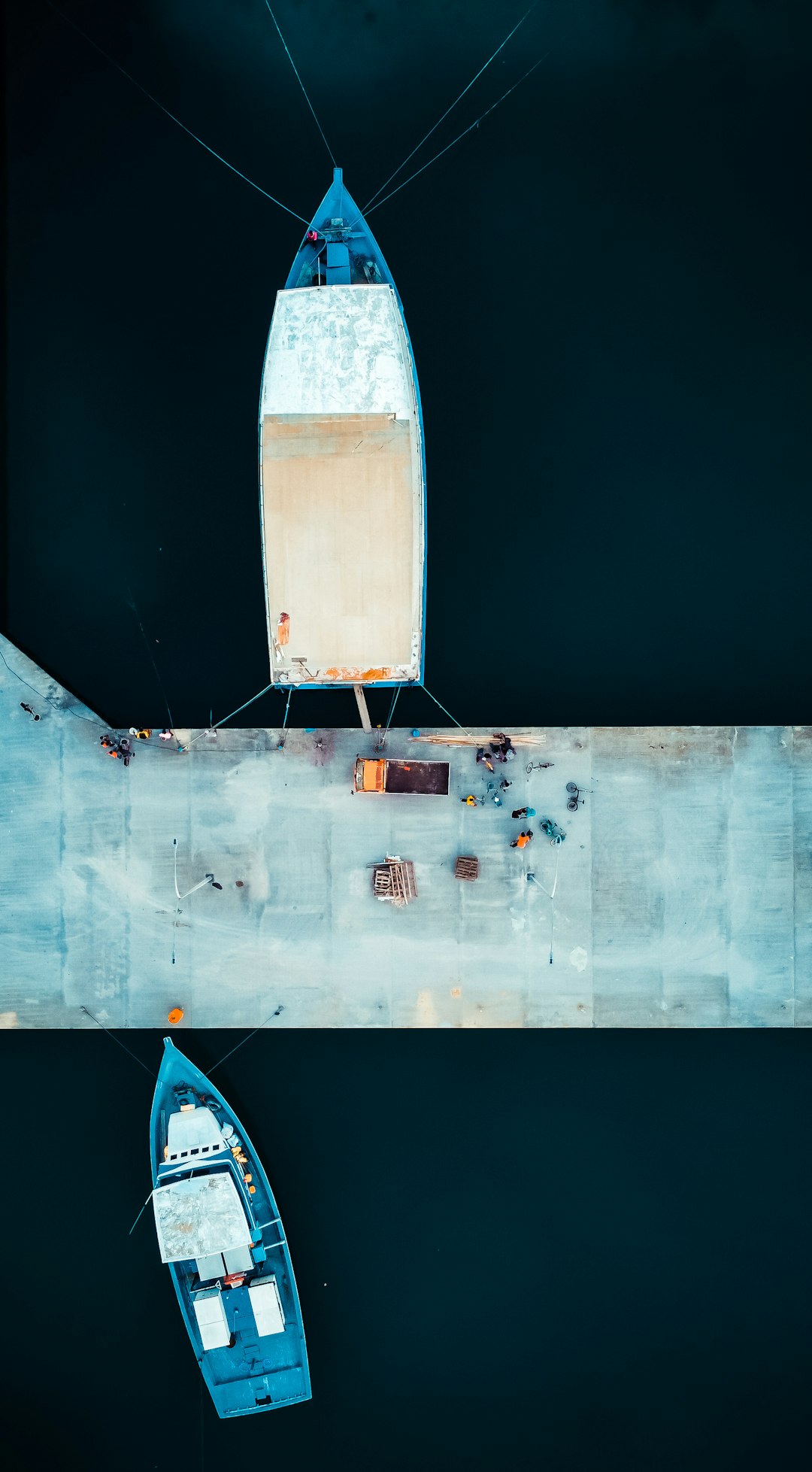 white and blue boat on body of water