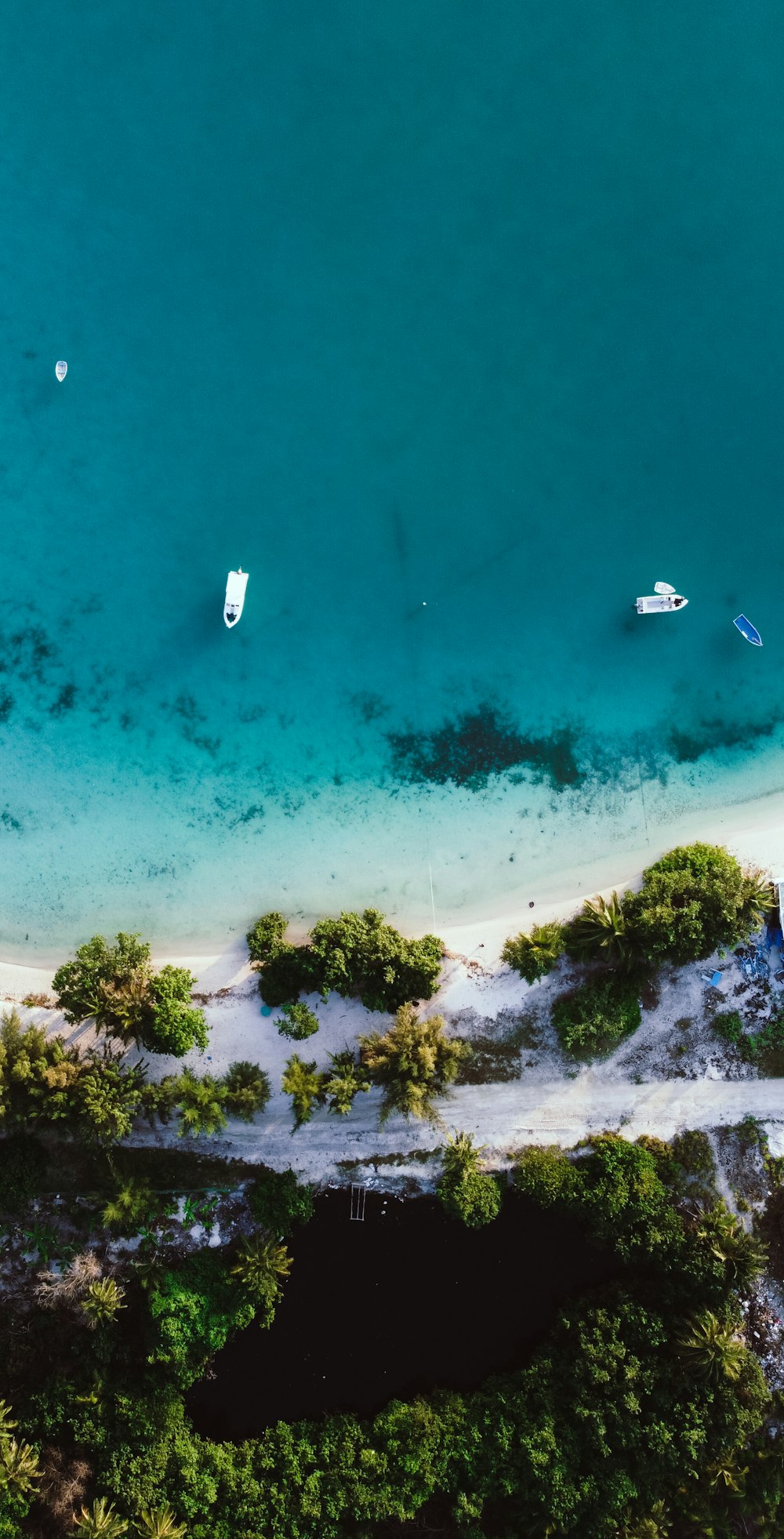 aerial view of white boat on sea during daytime