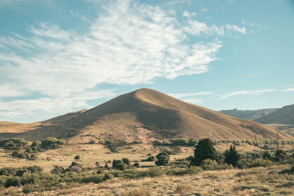 brown mountain under blue sky during daytime