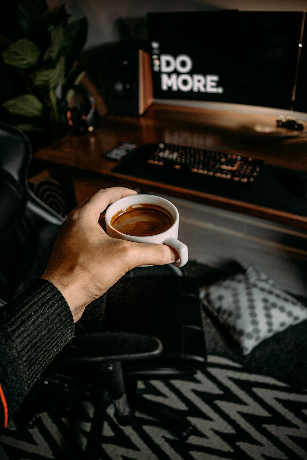 person holding white ceramic mug