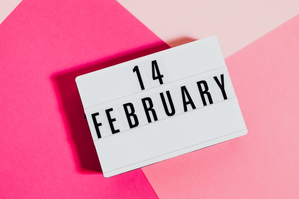 a pink and pink background with a sign that says 14th february