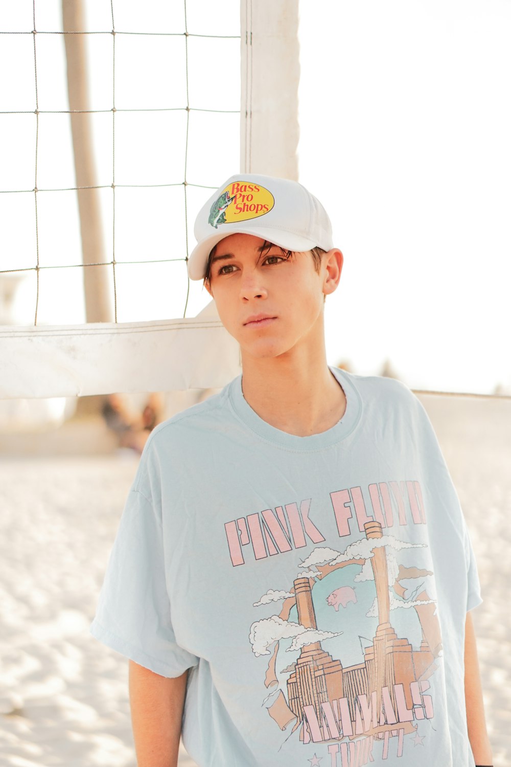 boy in white and red crew neck shirt wearing white and blue baseball cap