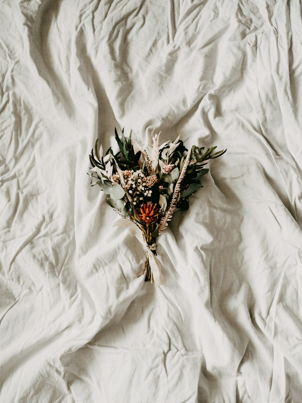 red and green flower on white textile