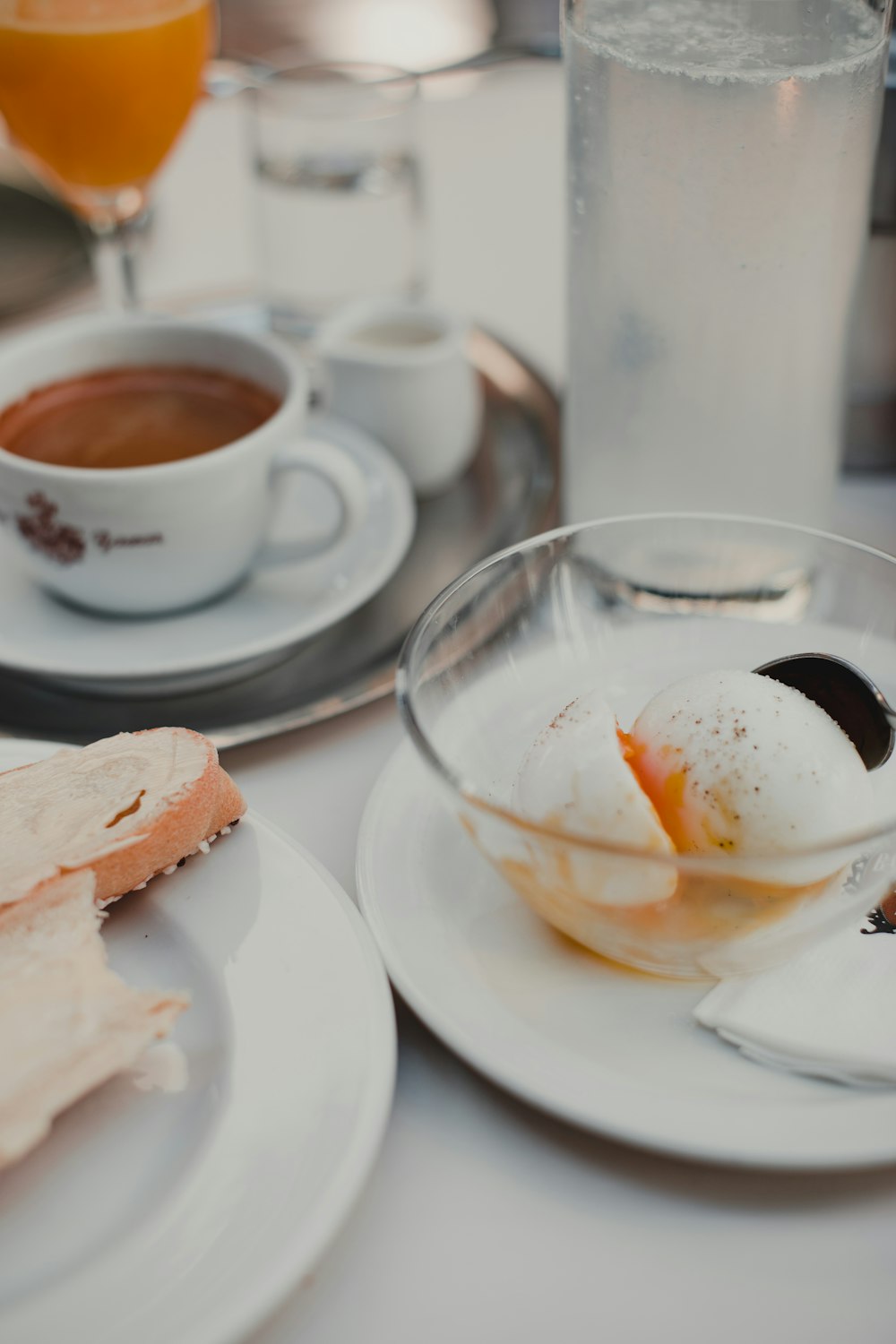 white ceramic teacup with saucer on table