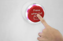 User happily clicking the big red convert button on a minimalist screen.