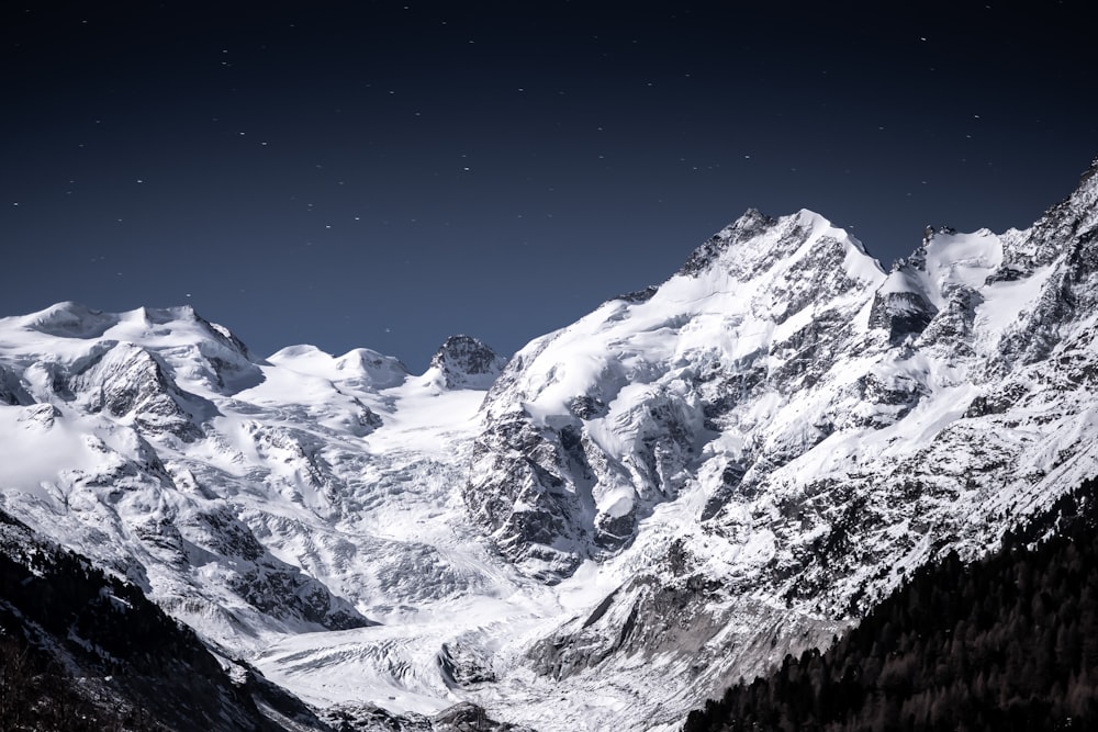 snow covered mountain under blue sky during daytime