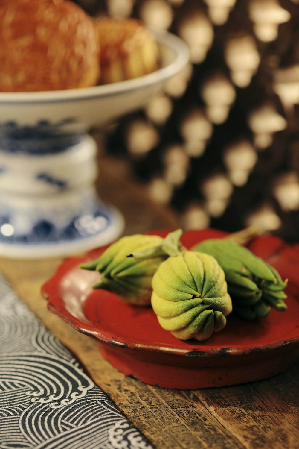 green leaves on red ceramic bowl