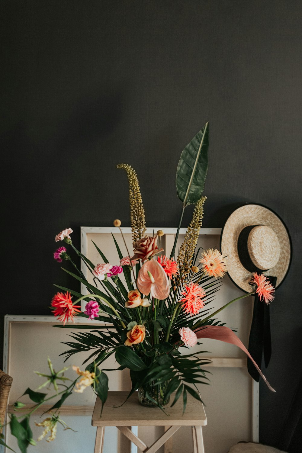 pink and white flowers on brown wooden table