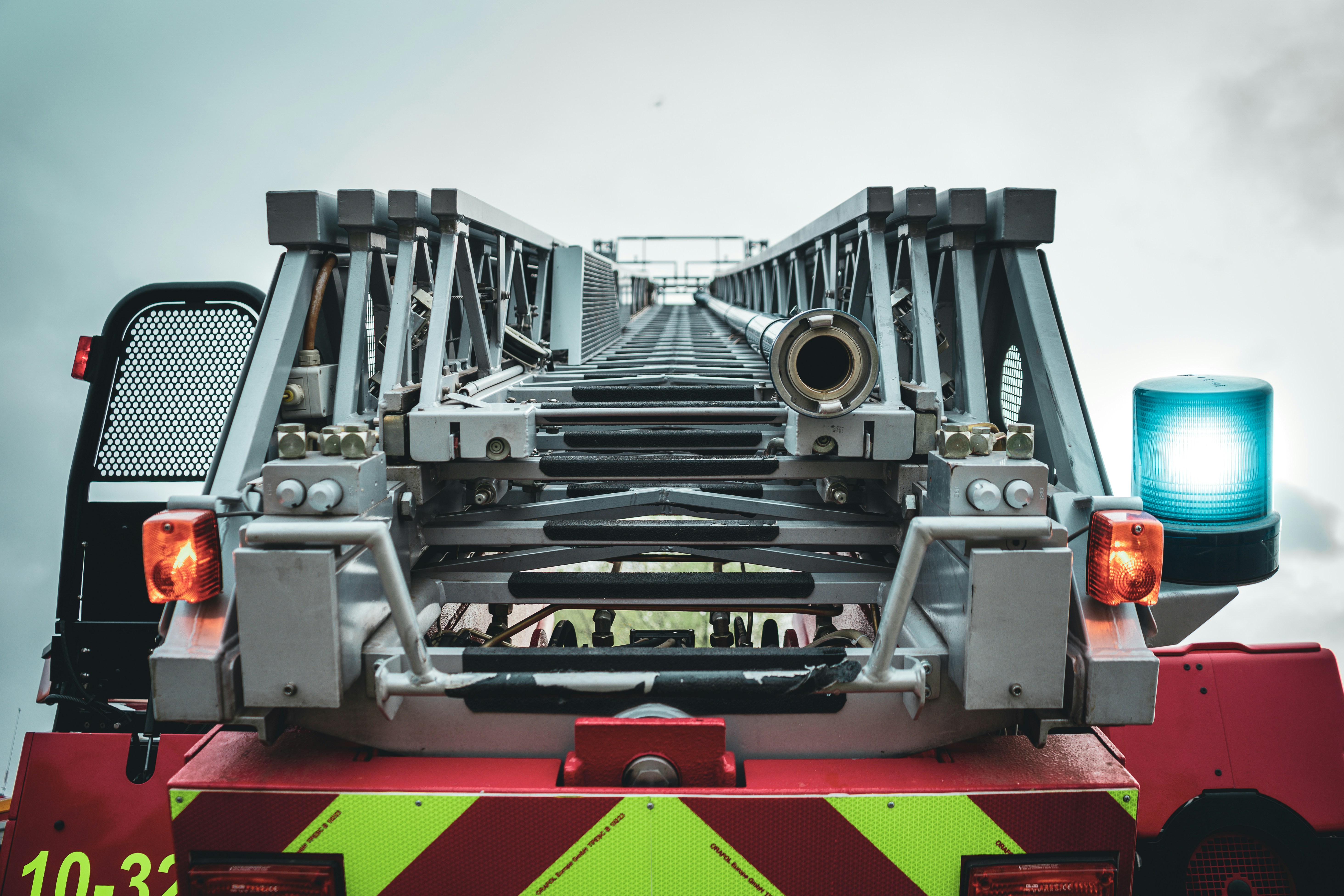 red and black truck under white sky during daytime