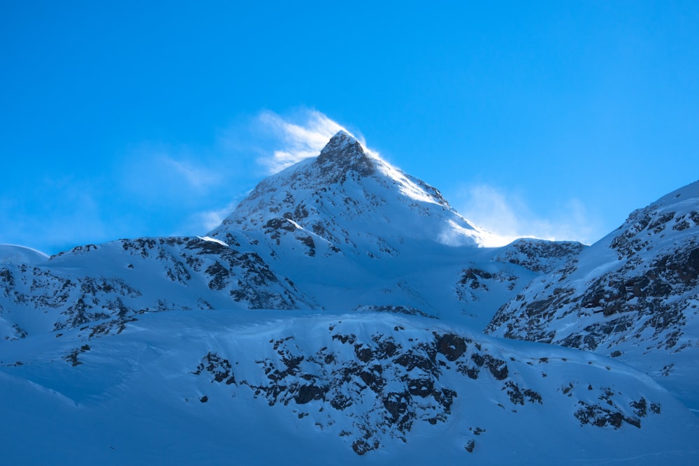 snow covered mountain under blue sky during daytime